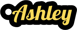 A keychain reading Ashley in yellow script lettering on a black plate.