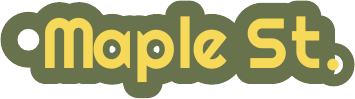 A keychain reading Maple St. in yellow lettering on a dark green plate.
