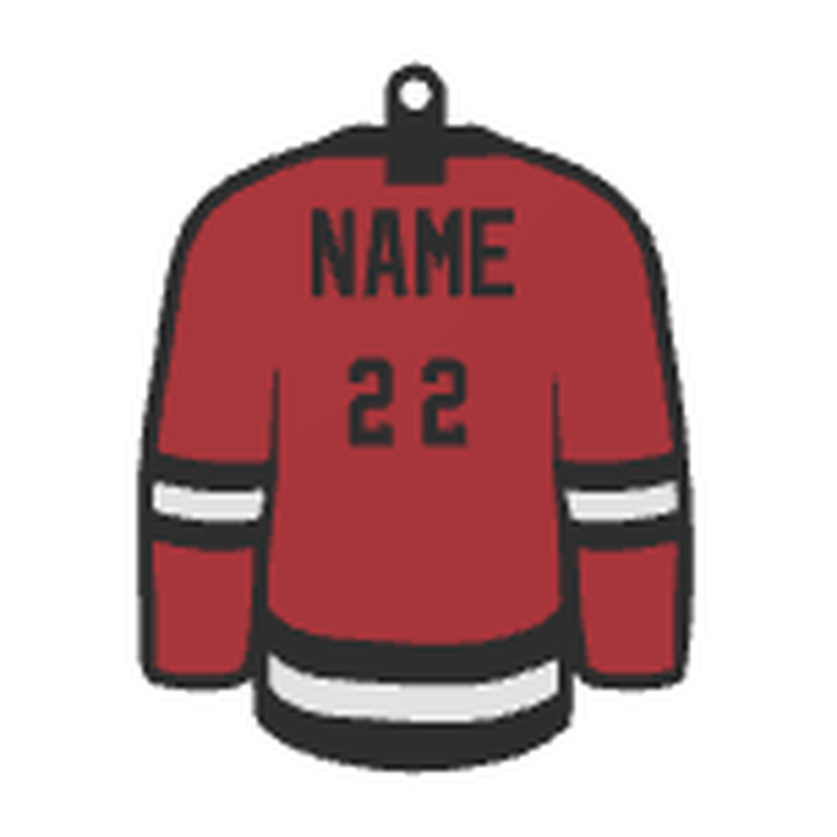 A keychain shaped like a red team jersey with a name and the number 22.